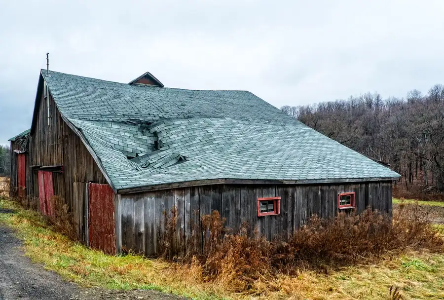 A weathered roof before replacement